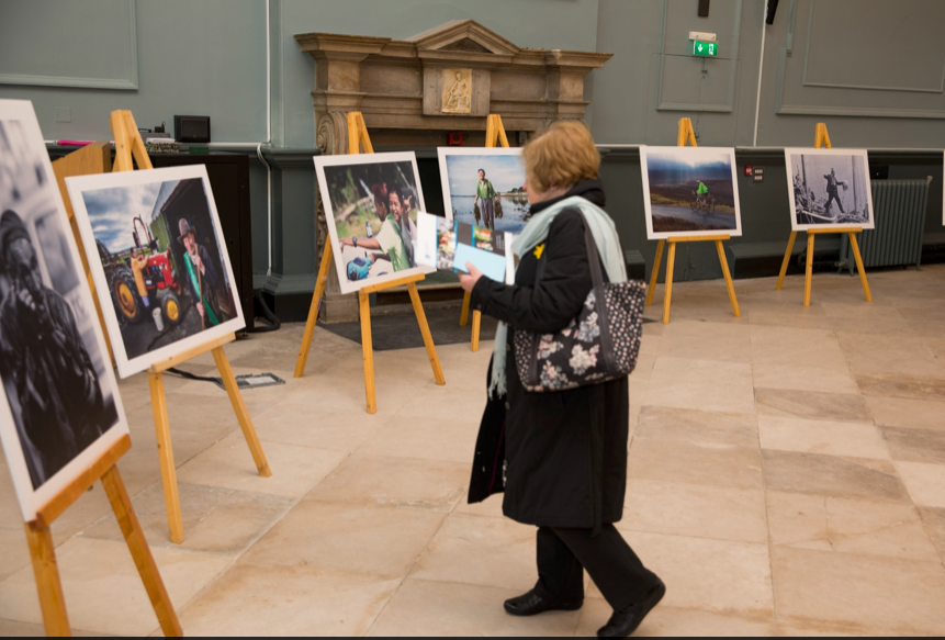 woman and paintings on easels