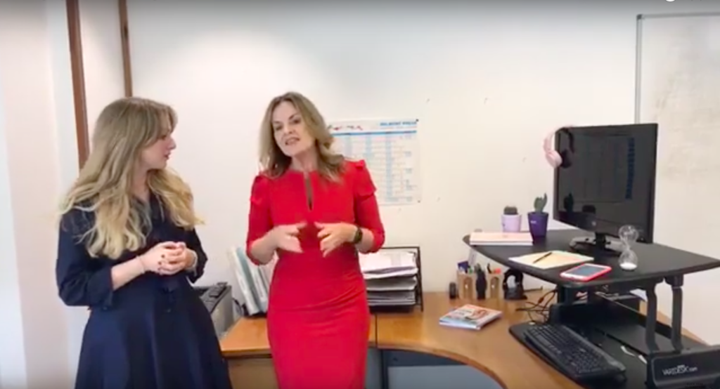 two women talking in an office