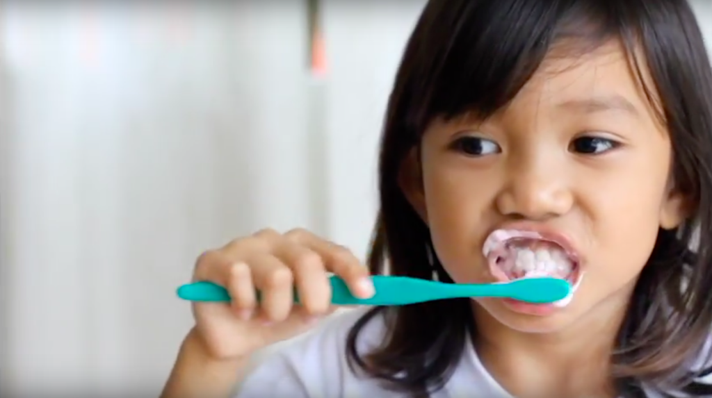 Girl brushing teeth