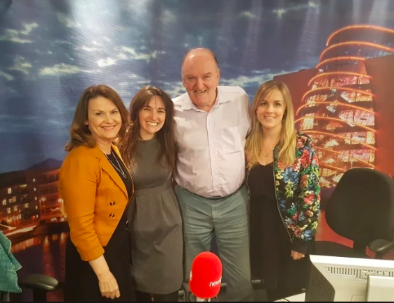 group of people in a radio studio