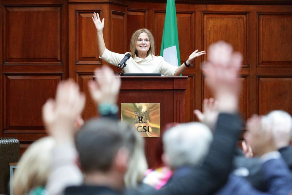 woman speaking at podium