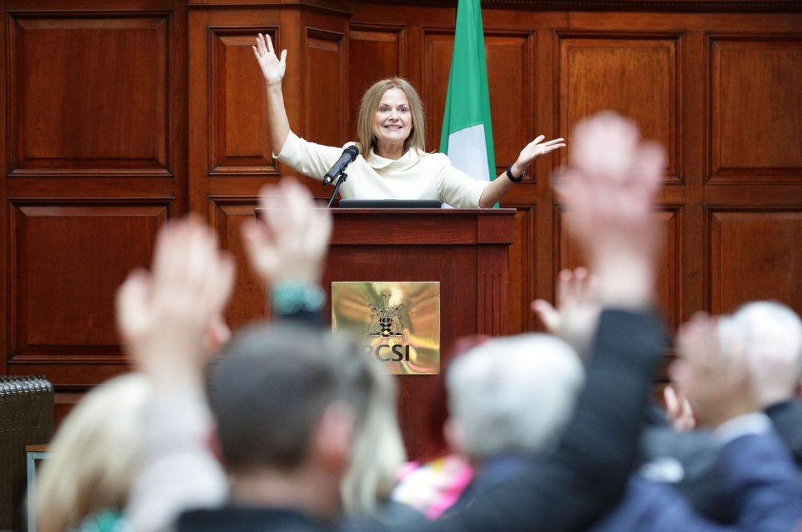 woman speaking at podium